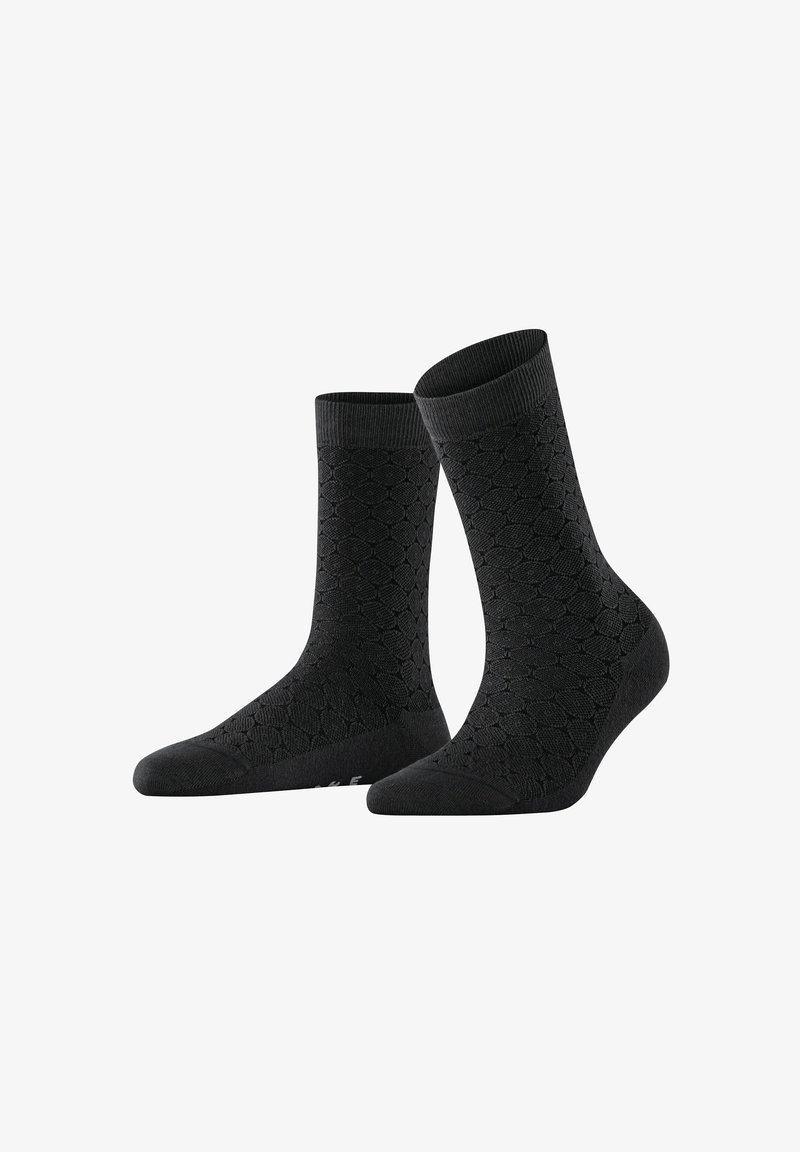 Schwarze Knöchelsocken mit einem strukturierten Wabenmuster, gefertigt aus einem weichen, elastischen Material mit gerippten Bündchen und verstärktem Zehen- und Fersenbereich.