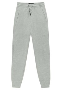 Pantalon de survêtement gris clair avec une taille élastique, un cordon de serrage ajustable, des poches latérales et des chevilles côtelées.
