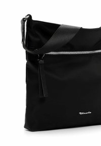 Black crossbody bag made of smooth fabric, featuring a top zipper, adjustable strap, and a silver logo accent on the front.