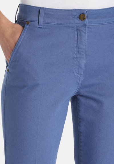 Light blue denim pants feature a smooth texture, straight leg design, front pockets, and a metal button closure.