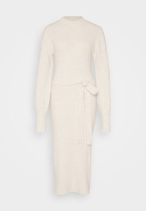 Knit sweater dress in off-white with long sleeves, mock neck, and a tie belt detail at the waist, featuring a fitted silhouette.