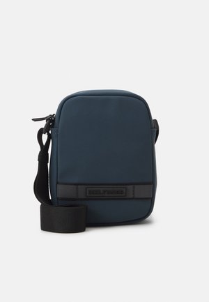 Tommy Hilfiger MONOTYPE MINI REPORTER UNISEX - Cross body bag - military denim