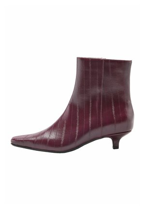 Shiny dark red ankle boot with subtle vertical texture, pointed toe, side zipper, and low kitten heel on white background.