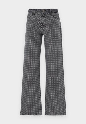 Wide-leg jeans in black denim with a white polka dot pattern; features a classic five-pocket design and button closure.