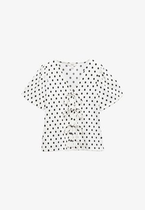 Bílý top s krátkými rukávy s černými puntíky, výstřih do V a dekorační šňůrky vpředu. Měkká textura a pohodlný střih.