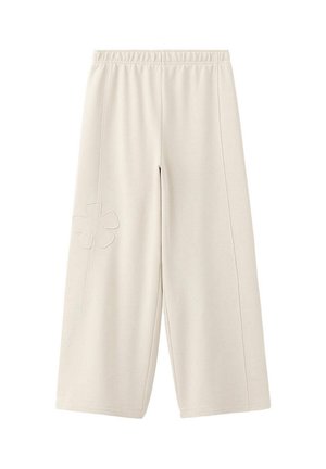 Pantalon beige à jambes larges avec taille élastique et détail de fleur cousue sur la cuisse gauche, présenté sur fond blanc.