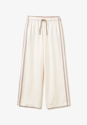 Pantaloni da tuta color crema con un design a gamba larga, caratterizzati da strisce laterali a contrasto di un marrone chiaro e una vita elastica con cordino.