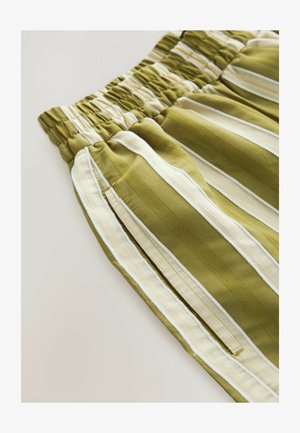 Oliivrohelised triibulised püksid elastse vöökohtaga. Omavad kontrastseid valgeid ja heledat beeži triibu, valmistatud pehmest kangast.