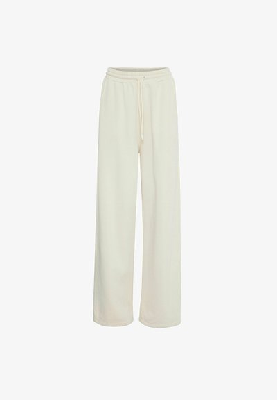 Kreemikas värviga laiad püksid, mis on valmistatud pehmest kangast. Omab elastset vööd, millel on pael ja pole nähtavaid mustreid ega aktsente.