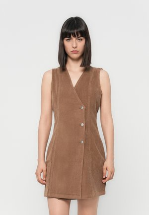 Brown corduroy sleeveless dress with a V-neck, featuring a buttoned front and vertical seam detailing, providing a fitted silhouette.