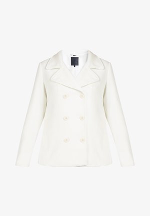 Baltas dvigubos krūtinės paltas su dideliais atvartais, pagamintas iš minkštos medžiagos. Yra šeši apvalūs mygtukai ir paprasta vidinė etiketė.