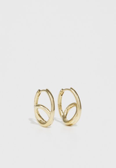 Gold hoop earrings featuring a double loop design. Smooth, shiny metal with a polished finish, showcasing a contemporary geometric style.