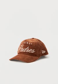 Brown cotton cap featuring embroidered "San Diego Padres" text in white, with a curved visor and a textured fabric design.