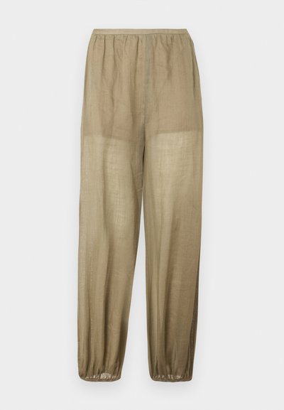 Pantalon en lin beige léger et ample avec une taille élastique et des poignets élastiques aux chevilles.