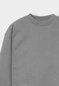 Gray sweatshirt with a round neckline, soft texture, and dropped shoulder seams. The fabric appears smooth and slightly brushed.