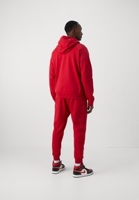 Jordan Kapuzenpullover - gym red/black