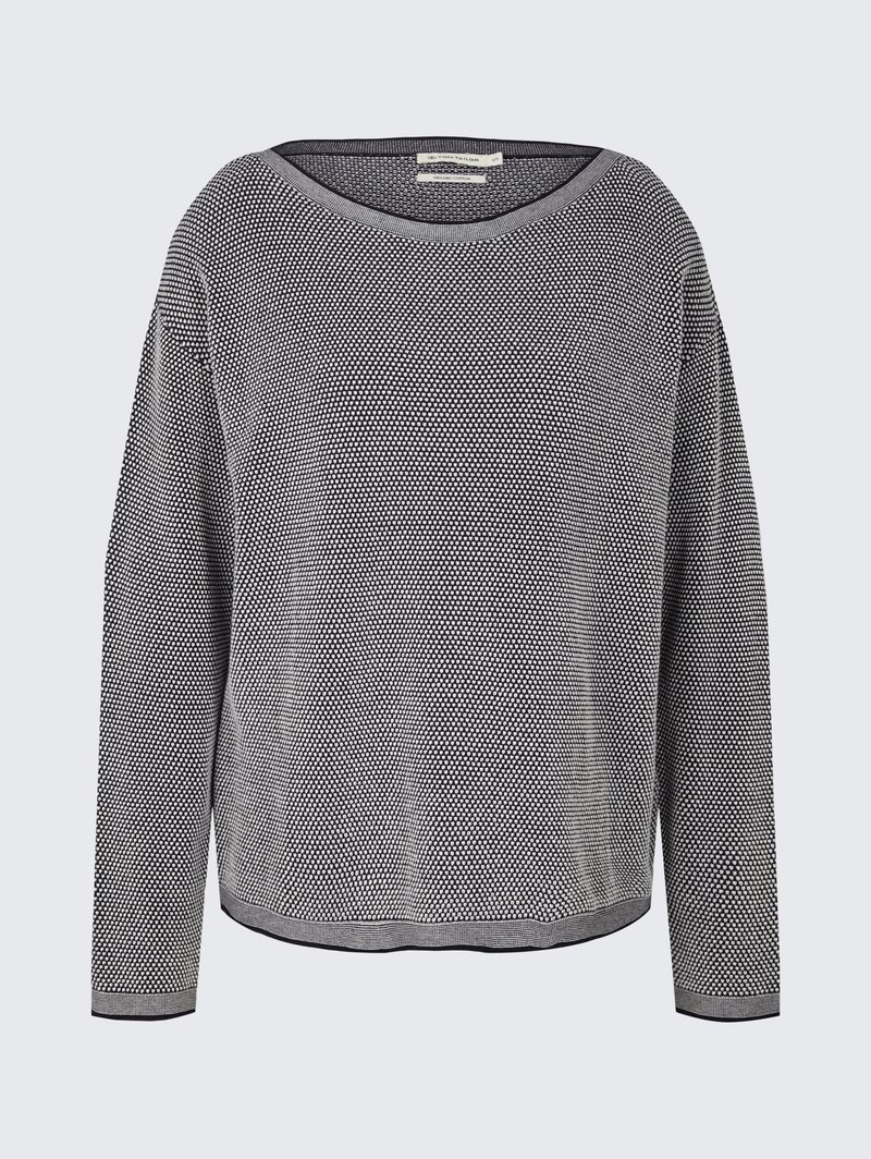 Czarny i biały sweter z teksturowanego dzianiny z długimi rękawami i okrągłym dekoltem, wyeksponowany na jasnoszarym tle.