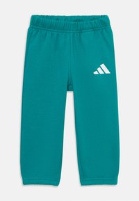 Mėtiniai jogger tipo kelnės, pagamintos iš medvilnės mišinio, su elastinga juosta ir balta Adidas logotipu kairėje pusėje. Paprastas dizainas, siaurėjančio silueto.