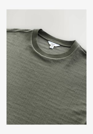 Oliivroheline ümar kaelus sweatshirt, millel on tekstuuriga muster, soonikkoes krae ja silt, millel on kirjas "NEXT", suurus M.