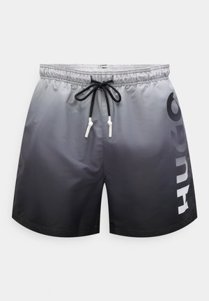 Kupaće gaće u sivom gradijentu, izrađene od laganog materijala. Imaju elastični pojas s uzicom i veliki logo sa strane.