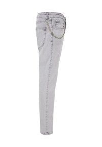 Heledhallid teksad slim-fit lõikega, millel on tagataskul chain aksessuaar ja nähtavad õmbluste detailid õmbluste ääres.