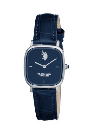 Montre-bracelet carrée en argent avec cadran bleu foncé et bracelet en cuir, comportant un logo de joueur de polo et des marqueurs horaires minimalistes.
