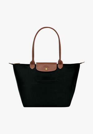 Schwarze Nylon-Shopper-Tasche mit braunen Lederakzenten, einem einzelnen Schultergurt, einem oberen Reißverschluss und einer kleinen Außentasche mit einem Verschluss.