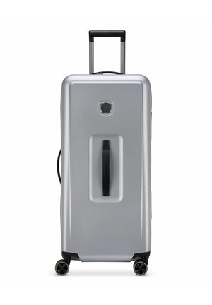 Silver hard-shell suitcase with a streamlined design, retractable black handle, and four multi-directional wheels for mobility.
