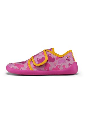Pink fabric shoes with a playful design featuring various pink patterns and cartoonish eyes. Velcro strap and pink rubber sole.