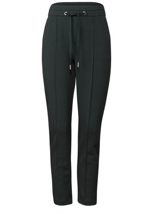 Pantalons de survêtement vert foncé avec une taille à cordon de serrage, jambes effilées, détails de couture latérale et accents métalliques aux extrémités du cordon de serrage.