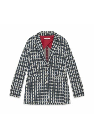 Blazer with a geometric pattern in navy and cream, featuring a red collar, two front pockets, and three-button closure. Cotton blend material.