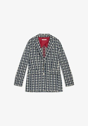 Blazer con motivo geometrico in blu navy e crema, con colletto rosso, due tasche frontali e chiusura a tre bottoni. Materiale in misto cotone.