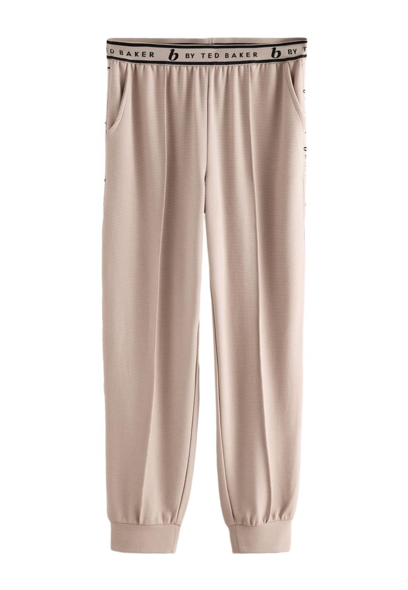 Smėlio spalvos, raukšlėtu raštu megzti sportiniai kelnės iš minkštos medžiagos, su elastine juosmens juosta su logotipu ir užsegamomis apačios; turi šonines kišenes.