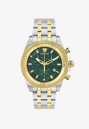 Zegarek chronograf z zieloną tarczą, złotą i srebrną stalową kopertą, wzorzystą obręczą i bransoletą w dwóch kolorach. CeFeaturesują się subtarczą i wyświetlaczem daty.
