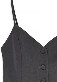 Gray dress with thin straps, v-neck design, and textured fabric. Features three circular buttons on the front for closure.