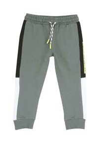 Gröna sweatpants med dragsko i midjan, med svarta, vita och gula paneler; mjukt tyg med ribbade ärmslut.