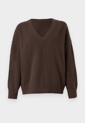 Maglione oversize marrone a scollo a V realizzato in morbido tessuto testurizzato con polsini e orlo a costine. Presenta spalle a caduta per una vestibilità rilassata.