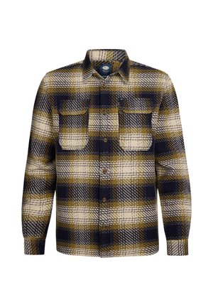 Camicia in flanella a quadri nei colori blu navy, crema e senape. Presenta due tasche sul petto, chiusura con bottoni e maniche lunghe con polsini arrotondati.