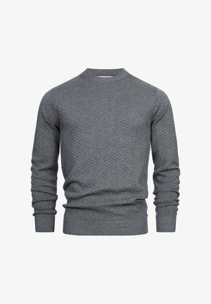 Szürke, hosszú ujjú pulóver, kerek nyakkivágással. Textúrált halszálka mintázattal és bordás mandzsettákkal, illetve szegéllyel rendelkezik.