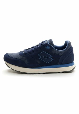 Navy blue athletic shoe with suede and textile upper, laces, padded collar, and a textured rubber sole. Features logo on side.