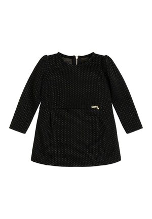 Zwarte lange mouw jurk met gouden stippen, ronde halslijn en een rits aan de achterkant. Heeft een kleine zijzak en een gladde textuur.