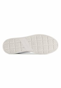 Sole of a sneaker with a textured white rubber surface. Features star-shaped pattern and "NINE WEST" branding embossed in the midsection.
