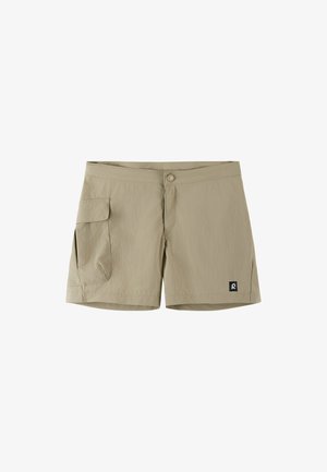 Beige knee-length shorts with a side flap pocket on left leg and button closure at waist, featuring a small black logo patch on the right hem.