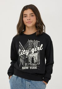 Felpa nera con grafica del Ponte di Brooklyn e testo "City Girl" in bianco, con polsini e orlo a coste.