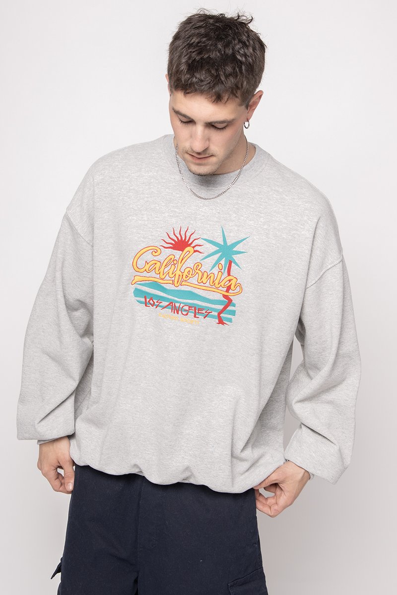 Felpa grigia con vestibilità ampia, caratterizzata da una grafica colorata "California Los Angeles", design di sole e palme, realizzata in cotone.
