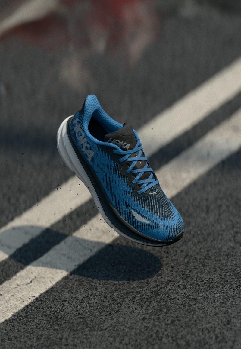 Scarpa da corsa blu con tomaia in rete e accenti grigi. Caratterizzata da un design leggero, motivo testurizzato, suola ammortizzata e dettagli riflettenti.