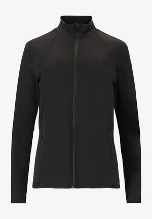 Svart softshell-jacka med hög krage, hel framslutning med dragkedja och raglanärmar. Har sidofickor och en mjuk, elastisk textur.