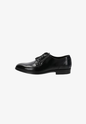 Chaussure habillée pour homme en cuir noir poli, avec laçage fermé, bout rond et talon bas empilé, vue de profil.