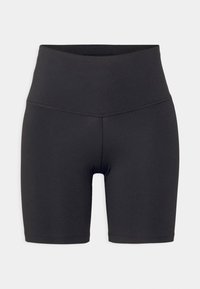 Shorts de cyclisme noirs taille haute en matière extensible avec une texture lisse. Dotés d'une large ceinture et de détails cousus.