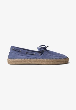 Navy blue suede espadrille with a jute rope sole, lace-up design, and metal eyelets, featuring a smooth texture and minimalist shape.